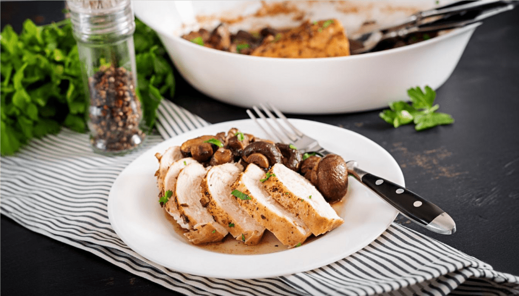 Baked chicken breast with mushrooms in balsamic sauce